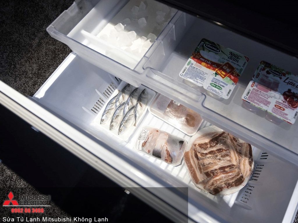 Fresh frozen fish and meat stored in Mitsubishi refrigerator for optimal preservation and quality.