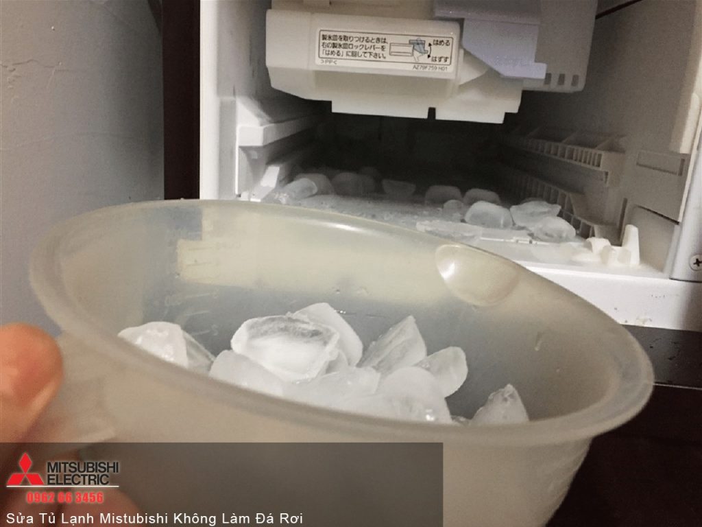 Ice cube tray inside a refrigerator for Mitsubishi electric refrigeration systems, part of Mitsubishi warranty service, focusing on maintenance and ice production.
