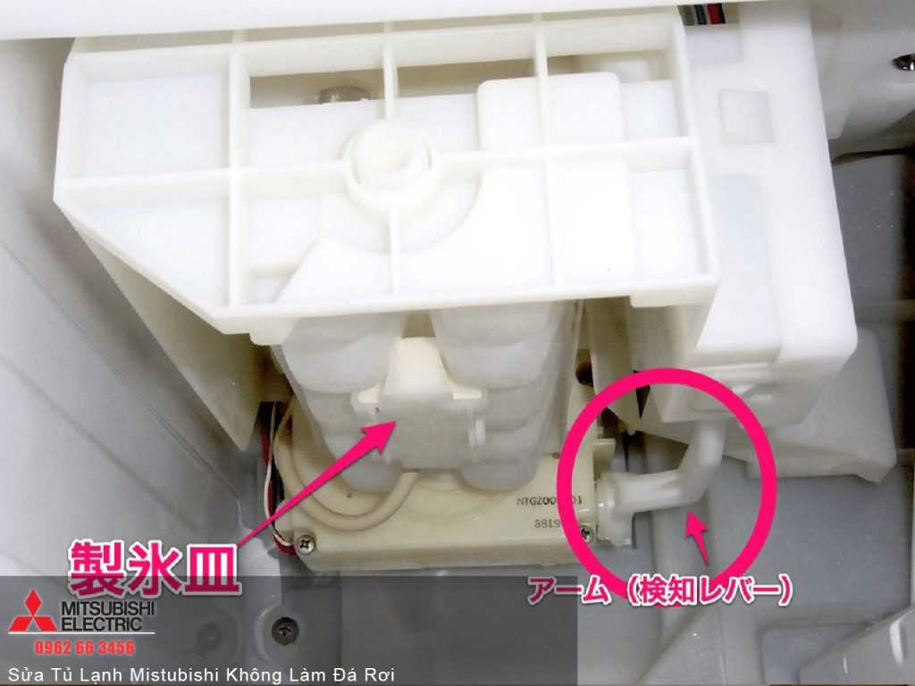 Replacement ice tray for Mitsubishi refrigerator with sensor arm and detection lever, part of the cooling system, in a white plastic box, showing detailed component connection for repair and maintenance.