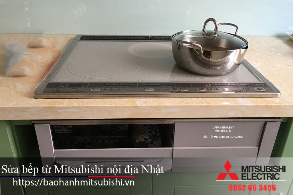 Induction cooktop with stainless steel pot, modern Mitsubishi electric stove, Japanese style kitchen appliance, energy-efficient cooking equipment, home kitchen cooking station.